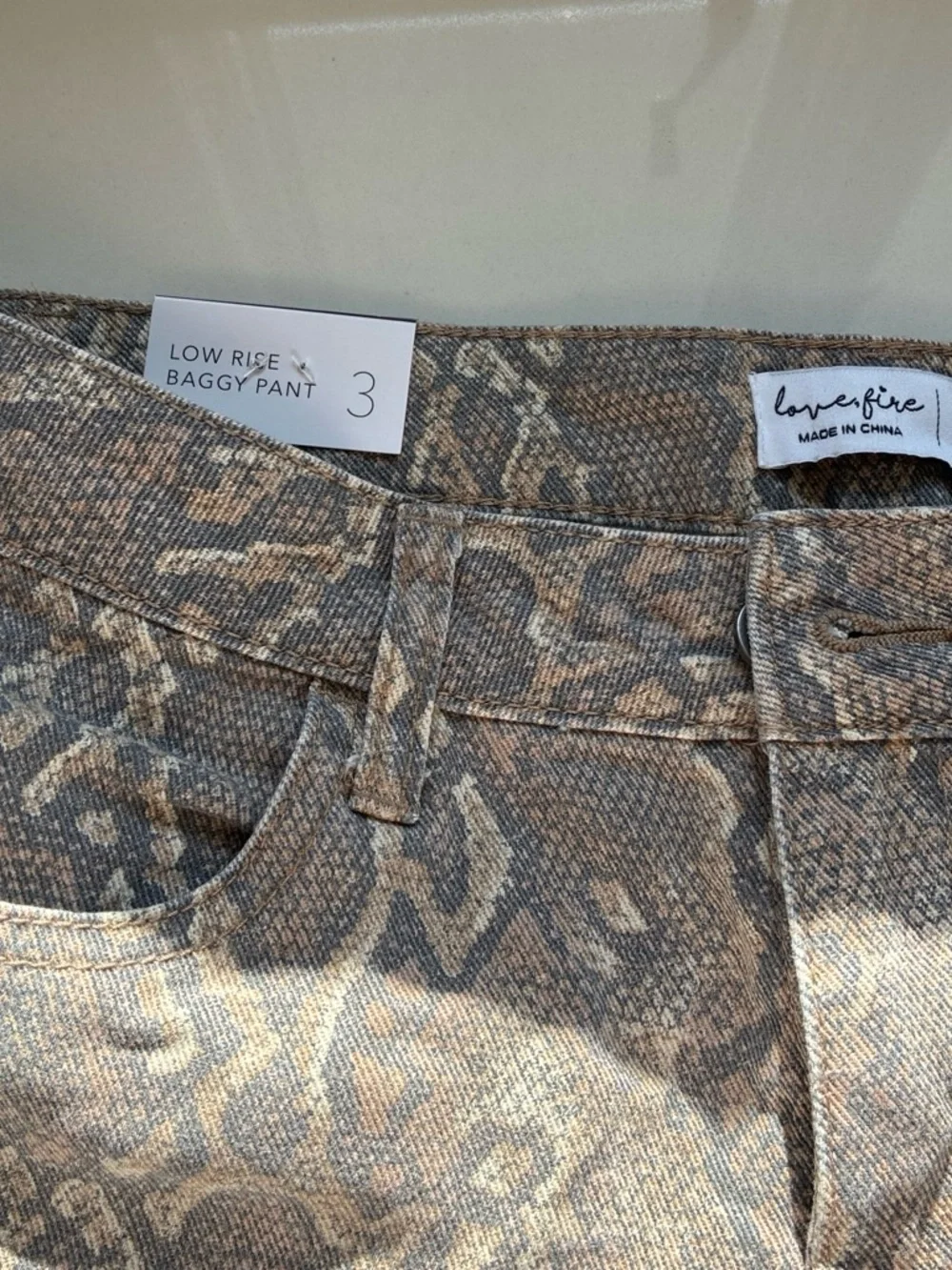 Snakeskin reptile print jeans